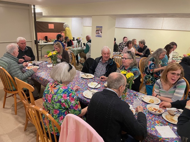 Friends sharing a meal in the basement
